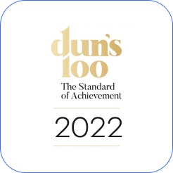 Dun's 100 2022 award logo featuring "The Standard of Achievement" text in gold lettering on a white background with blue border.
