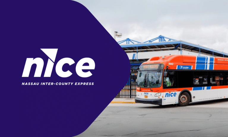 NICE Nassau Inter-County Express bus in orange and blue livery parked at a transit station with blue bridge structure visible in background.