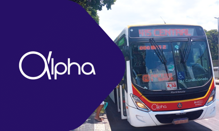 Alpha bus transit vehicle displaying route information on digital displays, featuring red and yellow livery with air conditioning amenities and accessibility features for passengers.