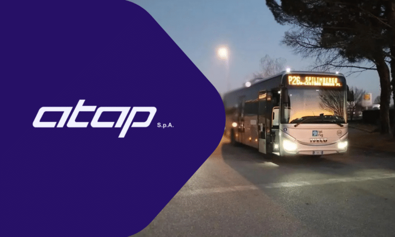 ATCAP S.P.A. public transit bus operates during twilight hours on an urban street, showcasing the company's branding and evening transportation service capabilities.