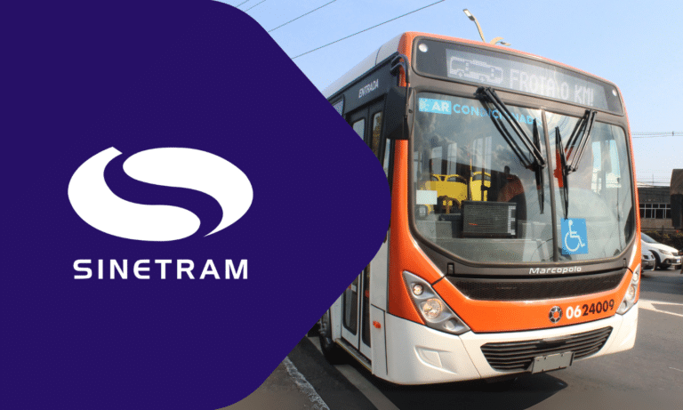 Sinetram public transit bus in orange and white livery with accessibility features, displaying route information on digital display and featuring the company's purple logo.