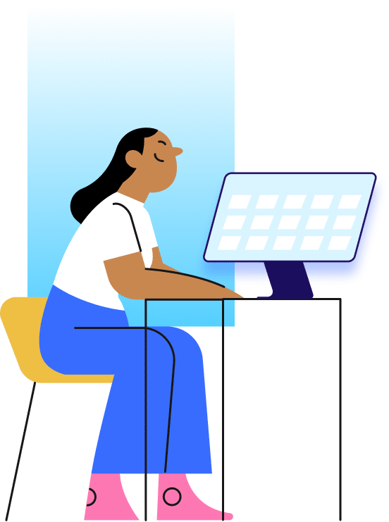 Woman sitting at desk working on laptop while viewing calendar schedule on computer monitor in modern office workspace.